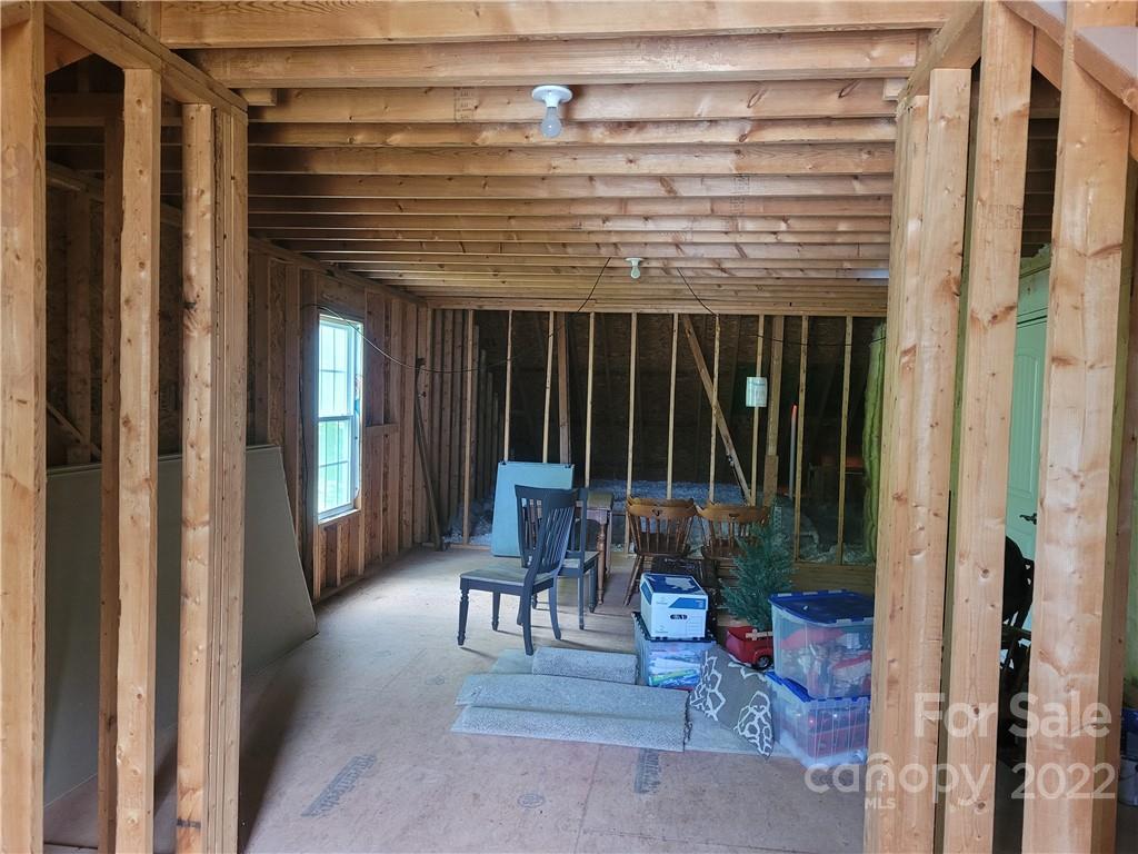 679 Presbyterian Road Mooresville, NC 28115 - Photo 18 of 25 a view of a porch with chairs and a window