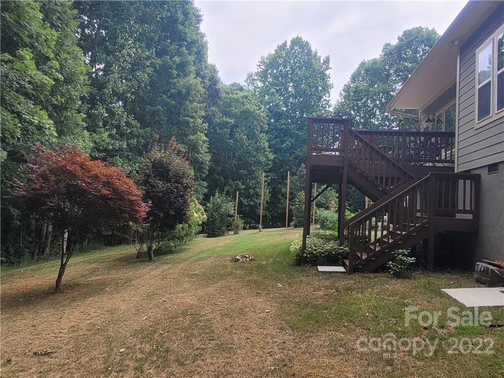 679 Presbyterian Road Mooresville, NC 28115 - Photo 19 of 25 a view of a barn in the middle of a yard