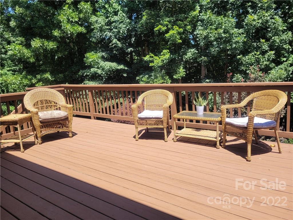 679 Presbyterian Road Mooresville, NC 28115 - Photo 20 of 25 a view of roof deck with chairs a barbeque with wooden floor and fence