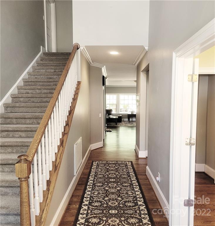 679 Presbyterian Road Mooresville, NC 28115 - Photo 2 of 25 a view of a hallway with wooden floor and staircase