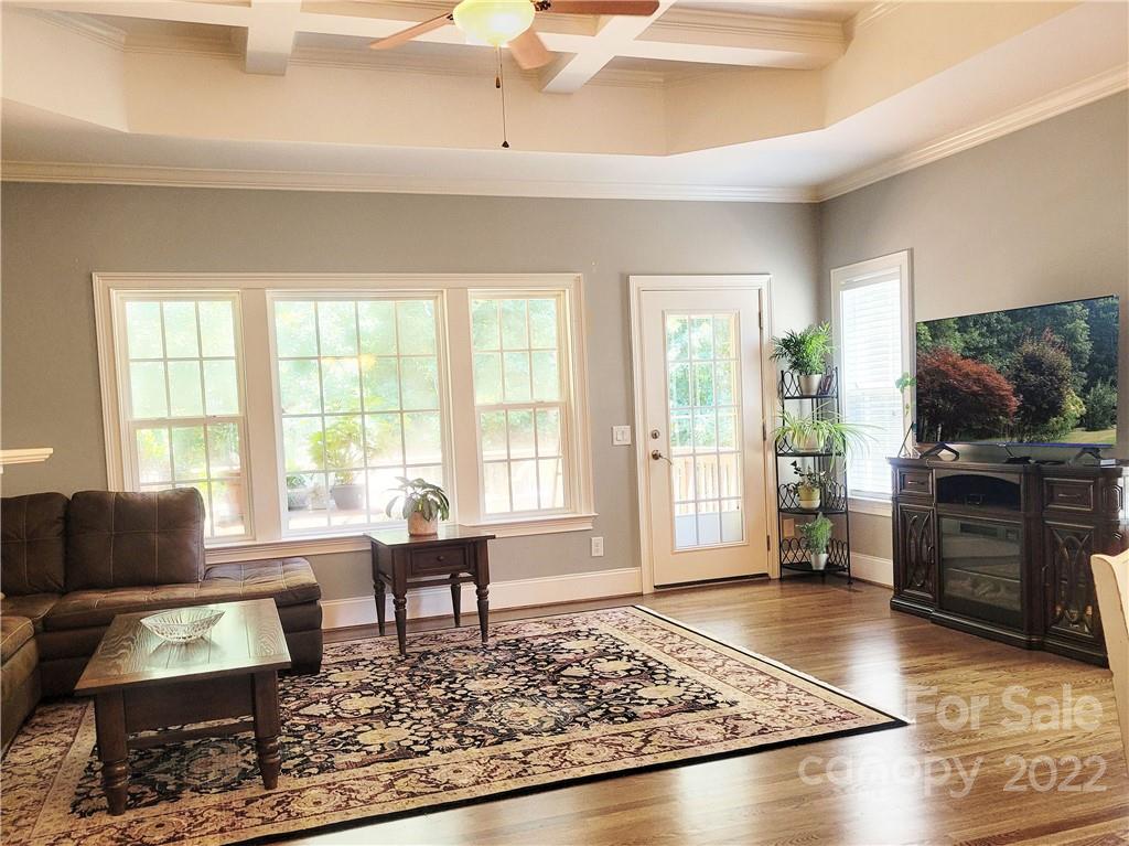 679 Presbyterian Road Mooresville, NC 28115 - Photo 5 of 25 a living room with furniture and a flat screen tv