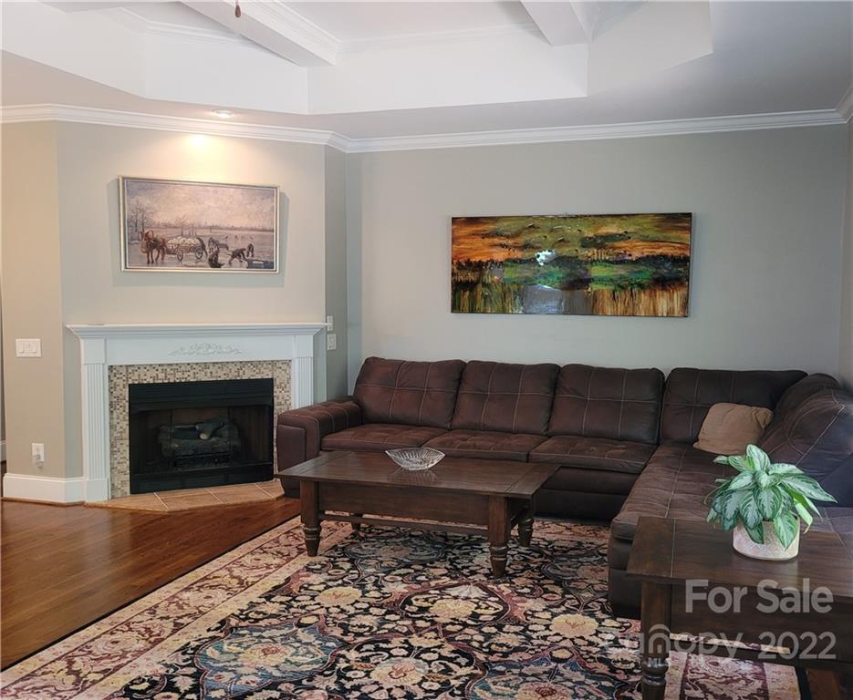 679 Presbyterian Road Mooresville, NC 28115 - Photo 6 of 25 a living room with furniture and a fireplace
