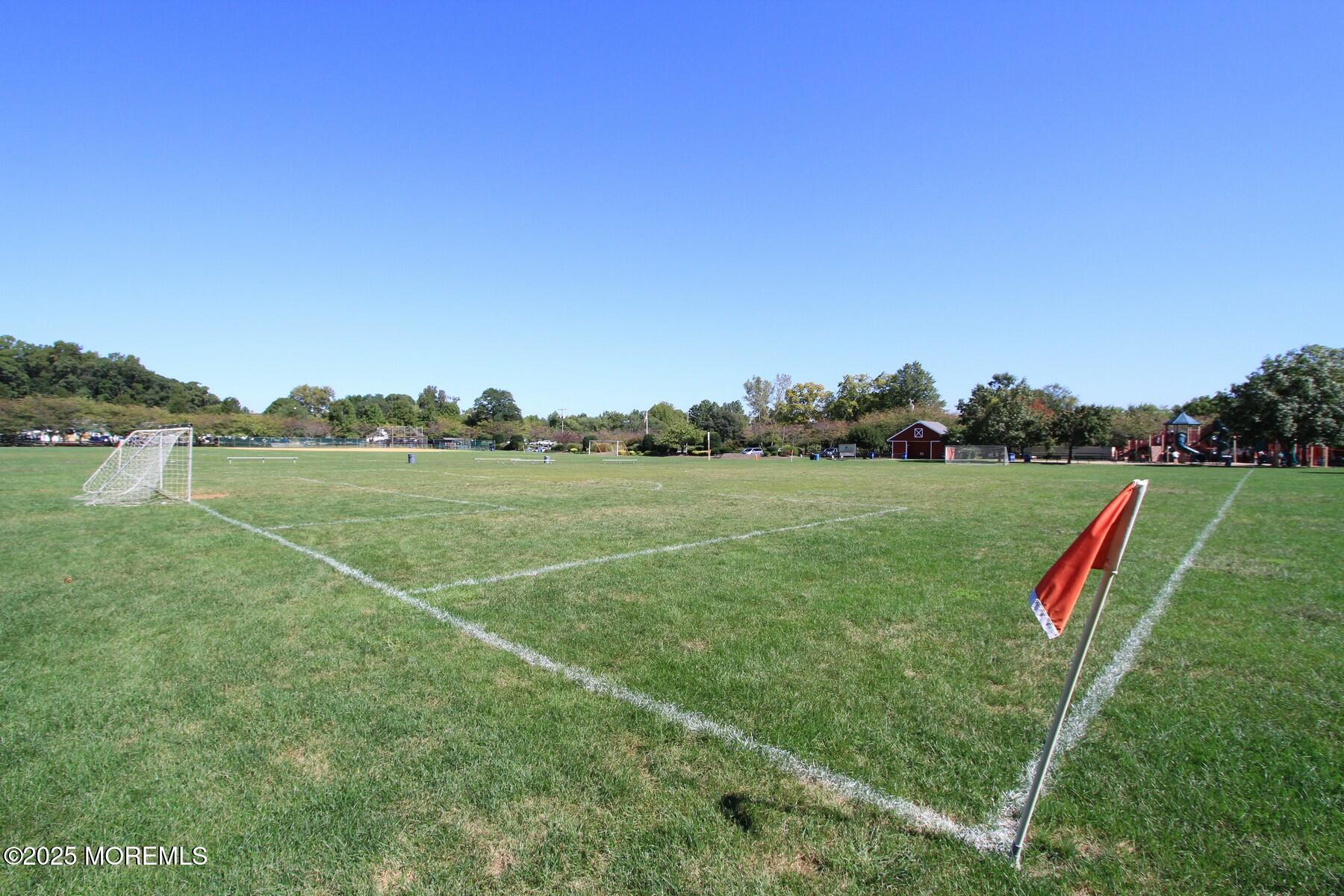 281 Hance Road Fair Haven, NJ 07704 - Photo 8 of 14 a view of a golf course with a lake