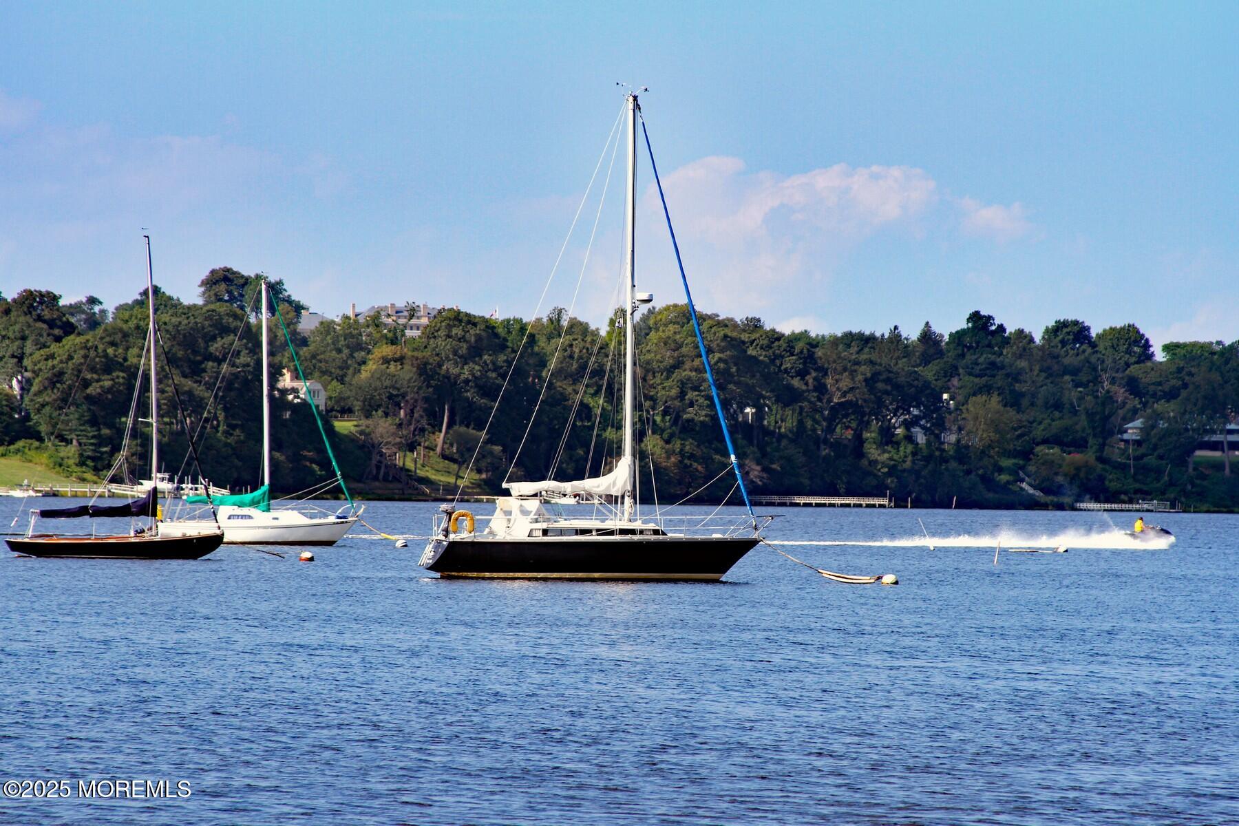 281 Hance Road Fair Haven, NJ 07704 - Photo 10 of 14 a view of a lake with boats and palm trees