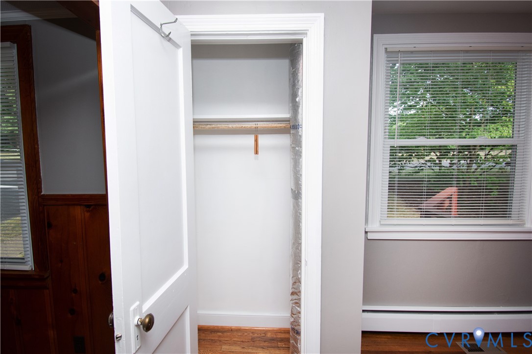6800 Three Chopt Road Richmond, VA 23226 - Photo 13 of 26 White-painted interior door with brass hardware
