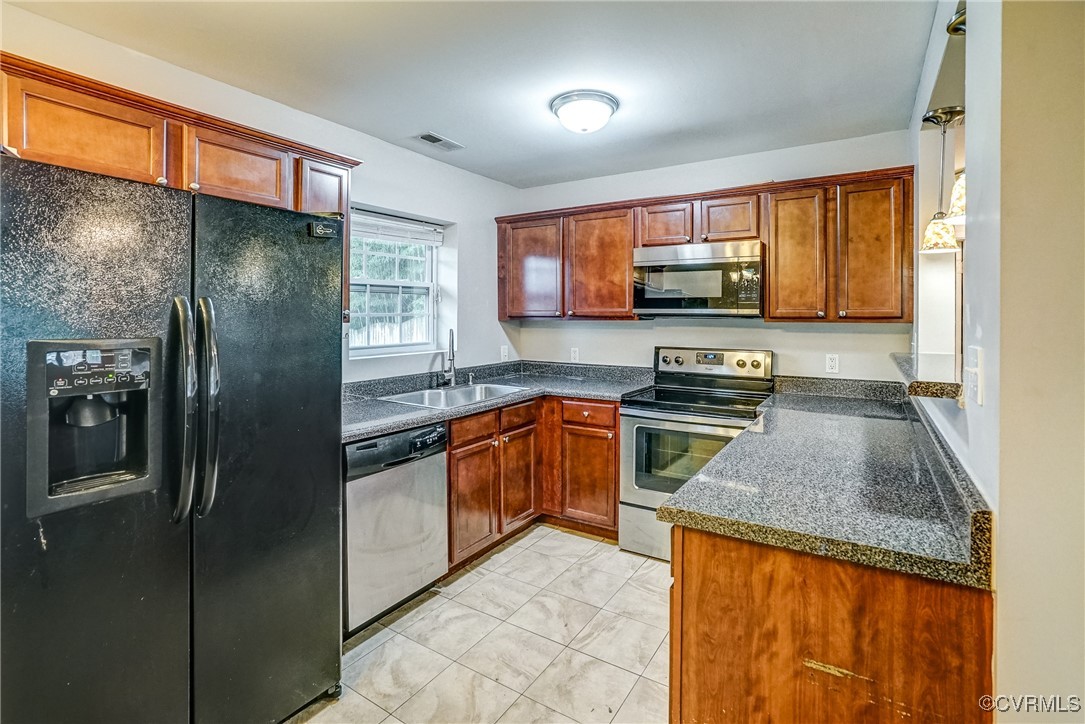 1305 Wembly Road Henrico, VA 23229 - Photo 13 of 28 Kitchen with sink and appliances with stainless st