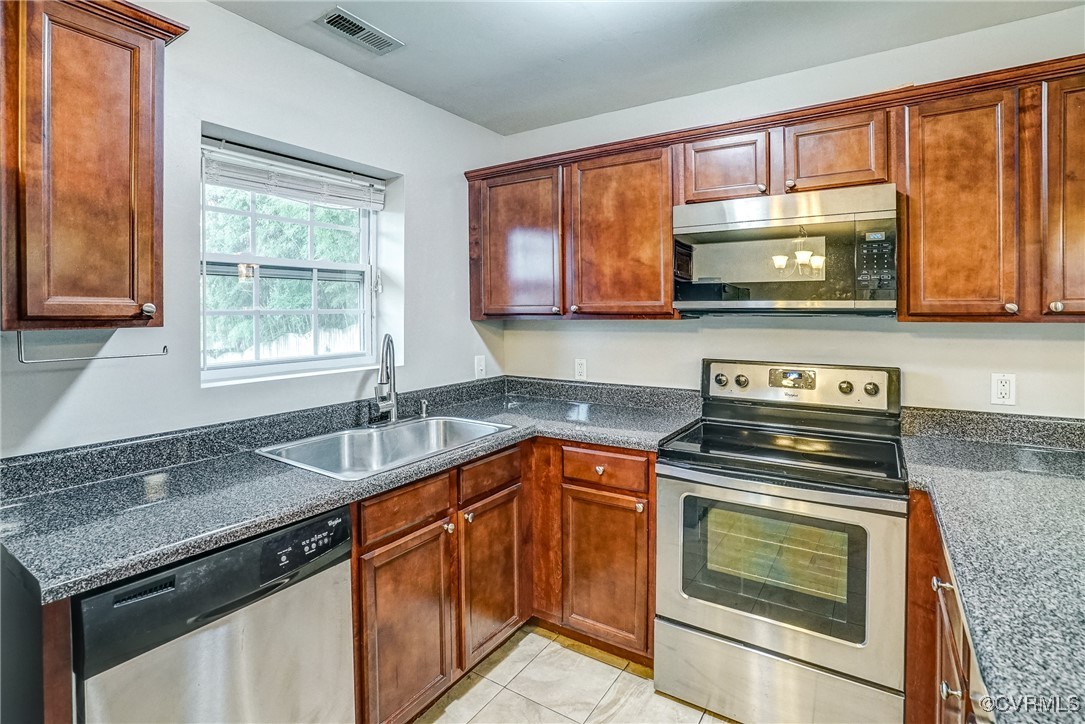 1305 Wembly Road Henrico, VA 23229 - Photo 14 of 28 Kitchen featuring light tile patterned flooring, s