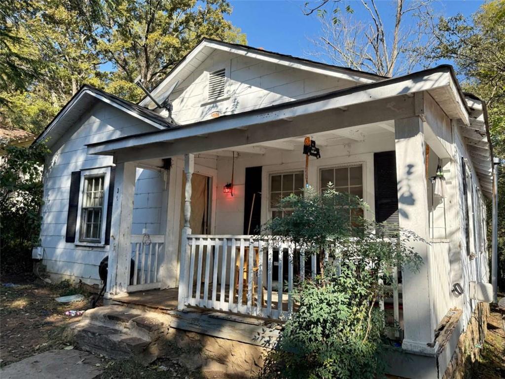 302 West Callahan Street Rome, GA 30161 - Photo 3 of 3 a view of a house with a small yard plants and large tree