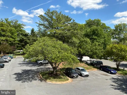 a view of a yard with cars parked