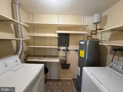 a view of storage and utility room with washer and dryer