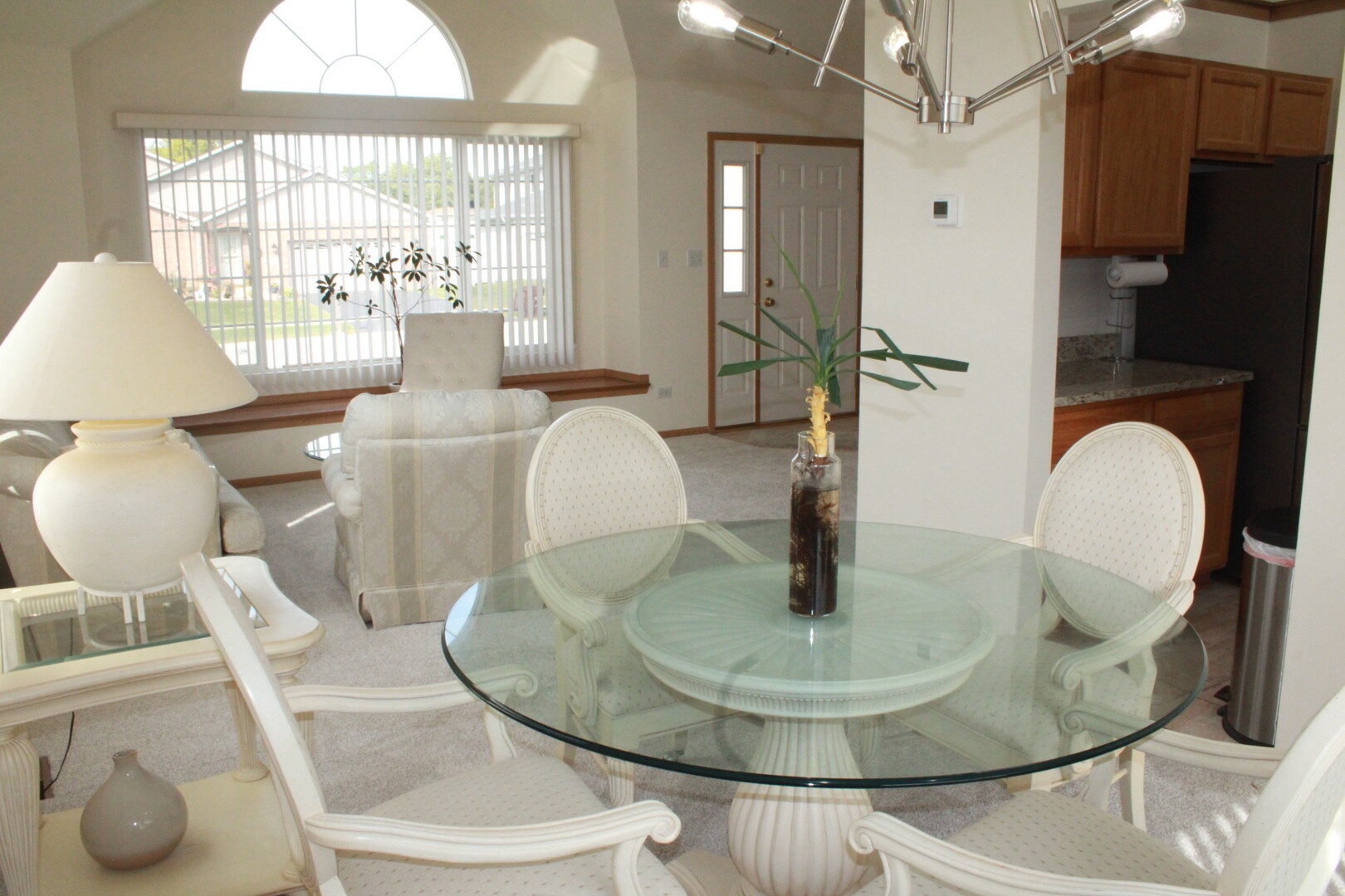 613 Farmview Road University Park, IL 60484 - Photo 3 of 22 a dining room with glass table and chairs