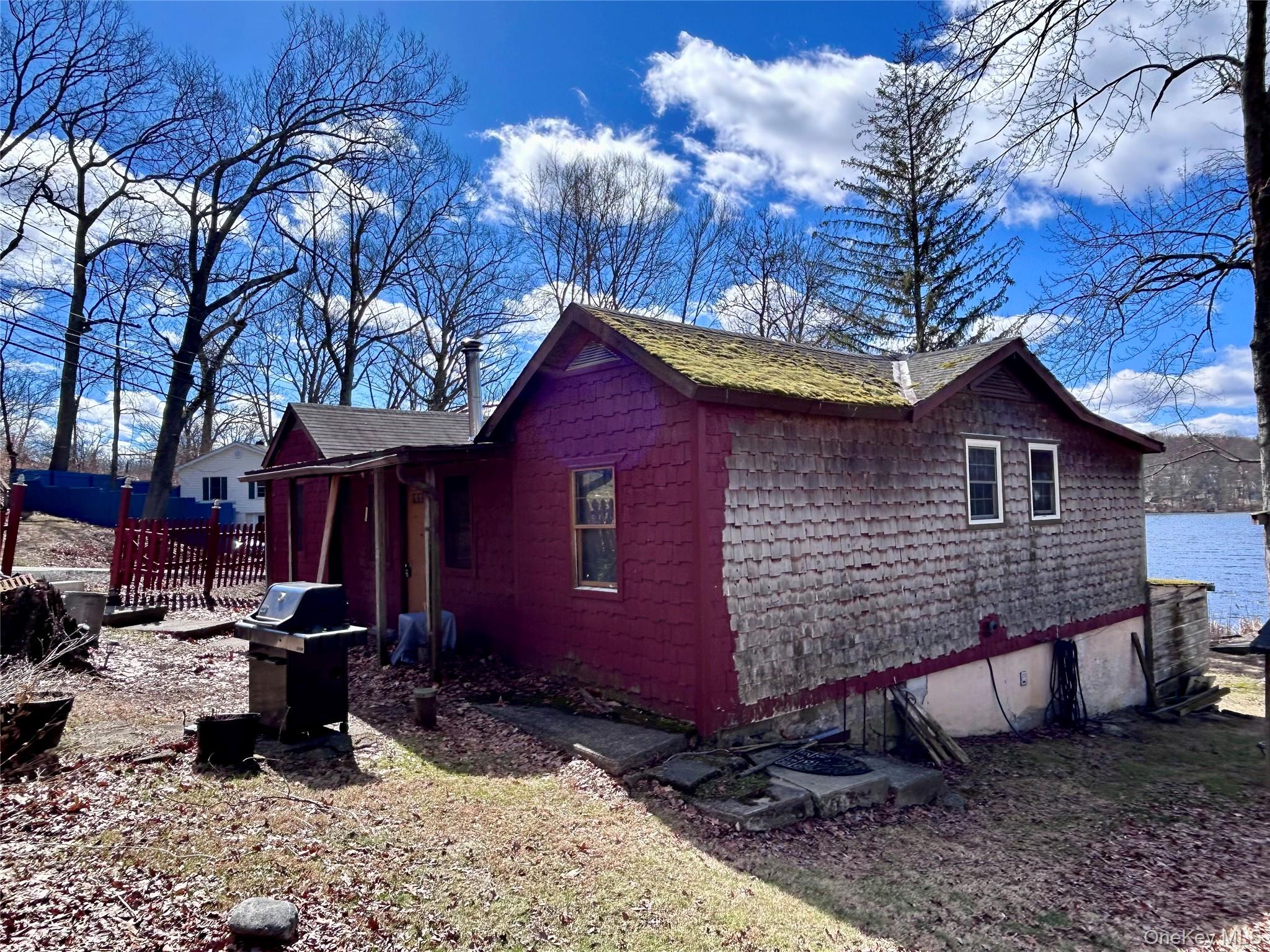 759 North Hillside Road Wappingers Falls, NY 12590 - Photo 2 of 13 a view of a house with a yard chairs and wooden fence