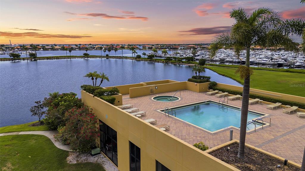 140 Riviera Dunes Way, Unit 206 Palmetto, FL 34221 - Photo 20 of 46 a view of a swimming pool with a terrace