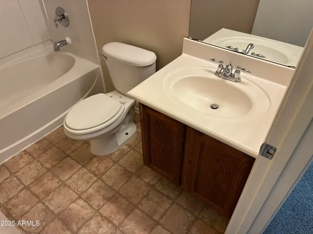 a bathroom with a tub and shower