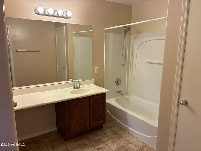 a bathroom with a sink and shower