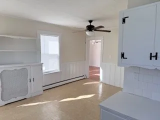 a view of a room that has a tub and a window