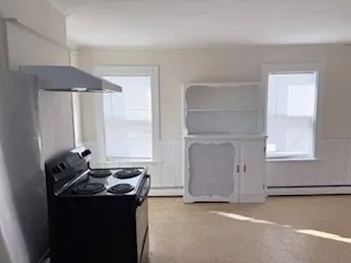 a room with a sink and a mirror