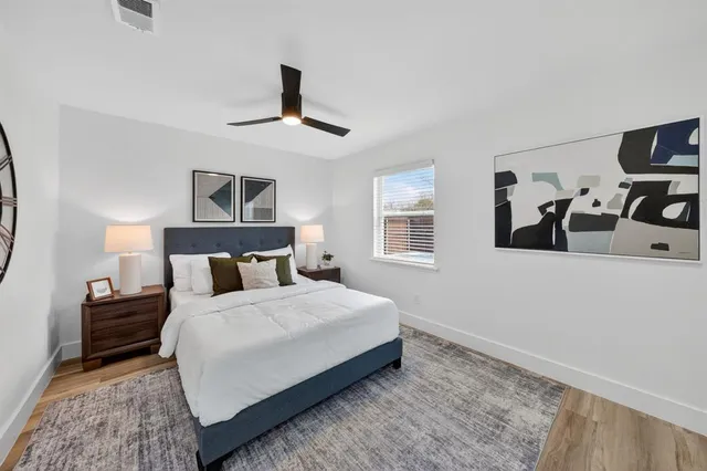 a bedroom with bed and window