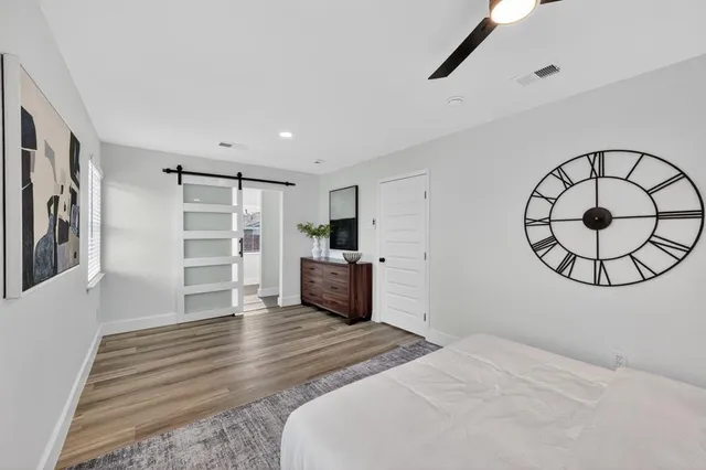 a bedroom with furniture and window