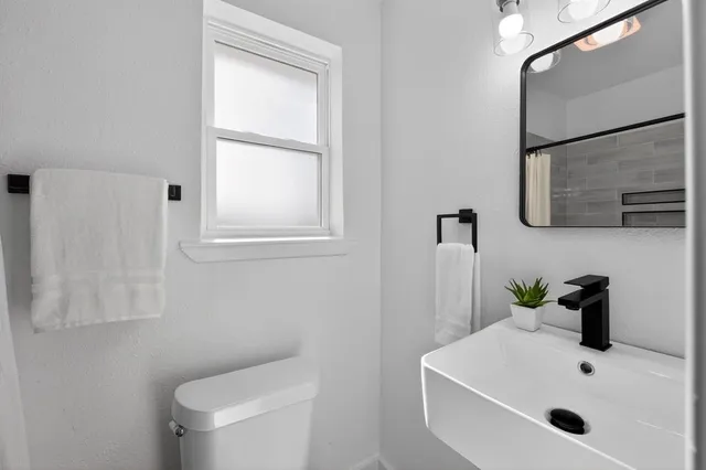 a bathroom with a sink and a toilet