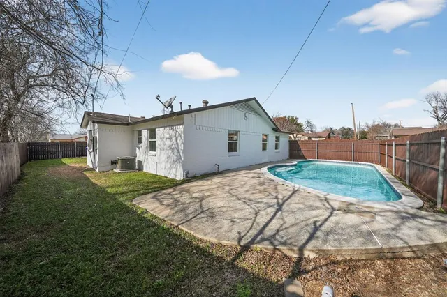 a view of a backyard of the house
