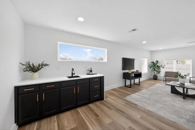 a spacious bedroom with a bed and a table in it