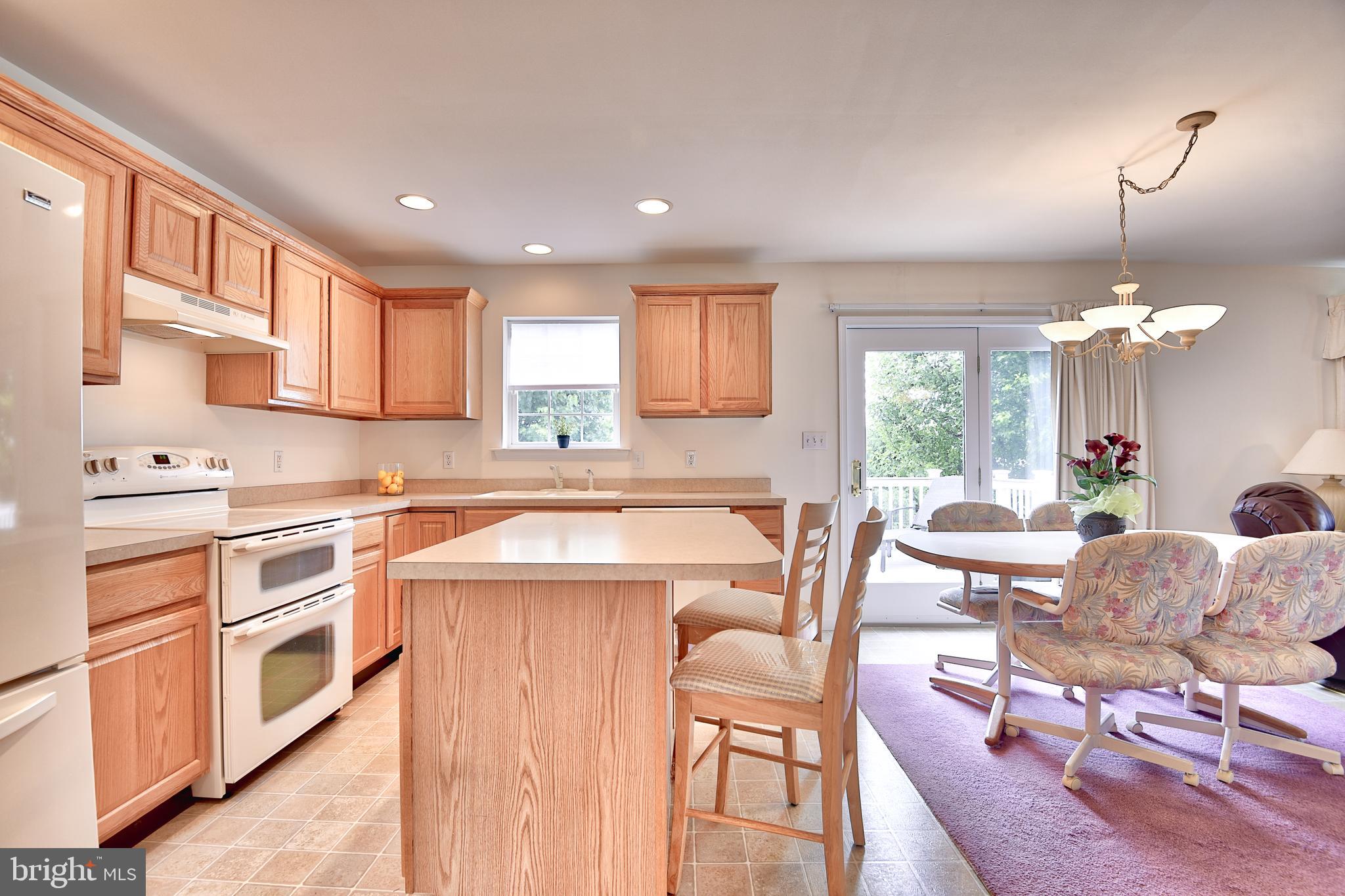 215 Runningboard Road Stewartstown, PA 17363 - Photo 5 of 30 Kitchen with Island, Opens to Breakfast Area