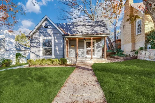 front view of a house with a yard