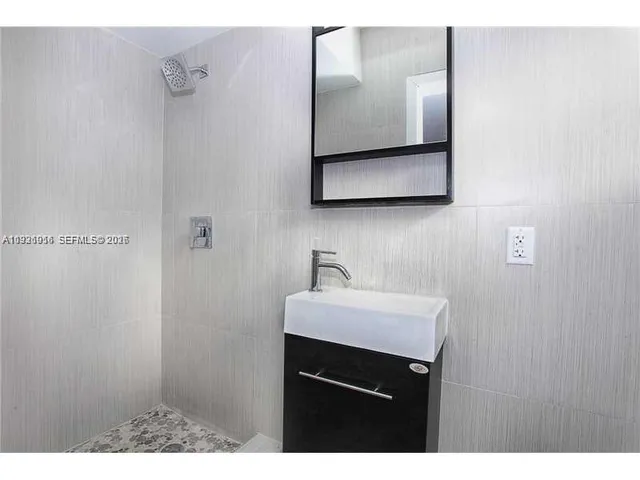 a bathroom with a sink and a toilet