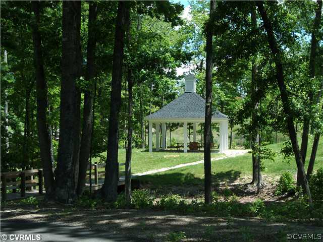 3636 Edenfield Road Midlothian, VA 23113 - Photo 6 of 7 a view of a big house with large trees and plants