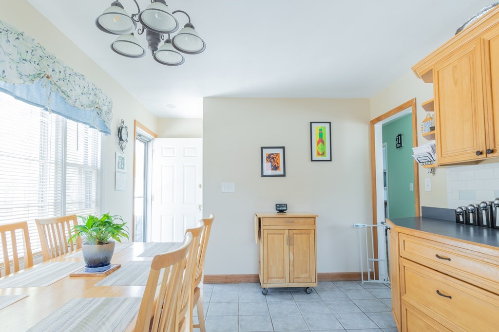 115 Ridgewood Road New Bedford, MA 02745 - Photo 18 of 28 a view of a dining table and chairs in a room