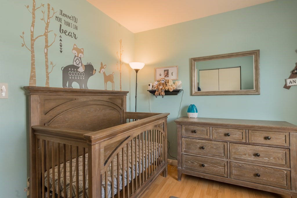 115 Ridgewood Road New Bedford, MA 02745 - Photo 19 of 28 a bedroom with a bed and a dresser