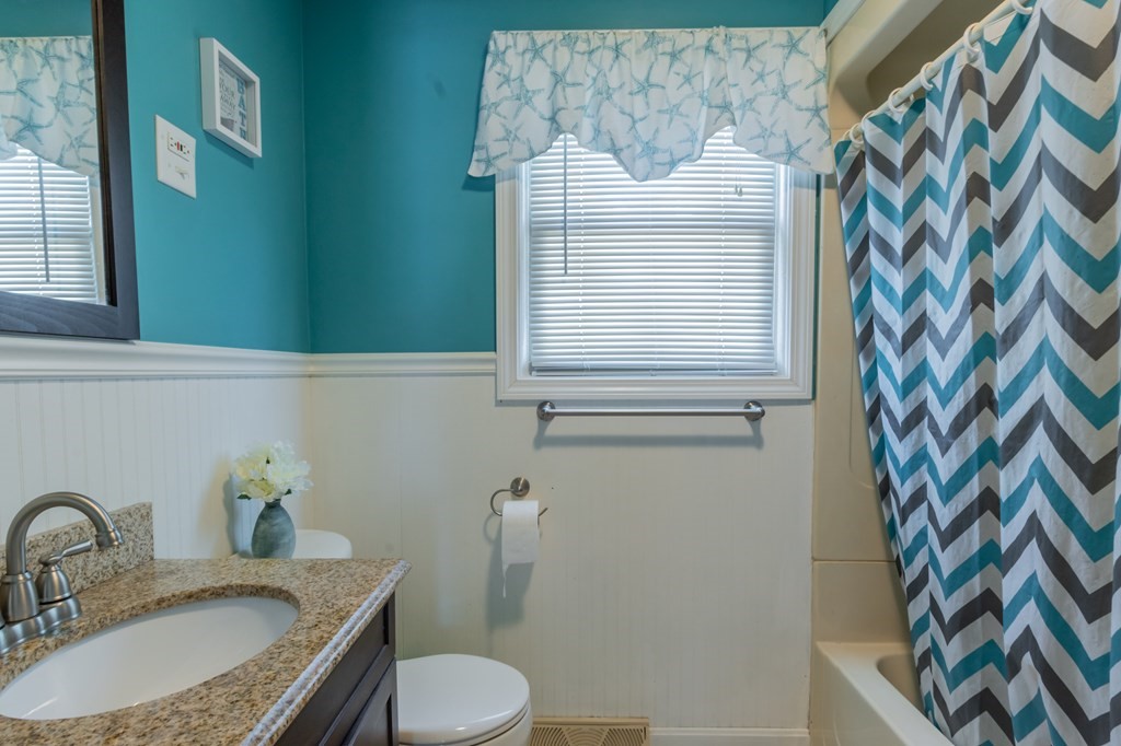 115 Ridgewood Road New Bedford, MA 02745 - Photo 22 of 28 a bathroom with a sink toilet and mirror