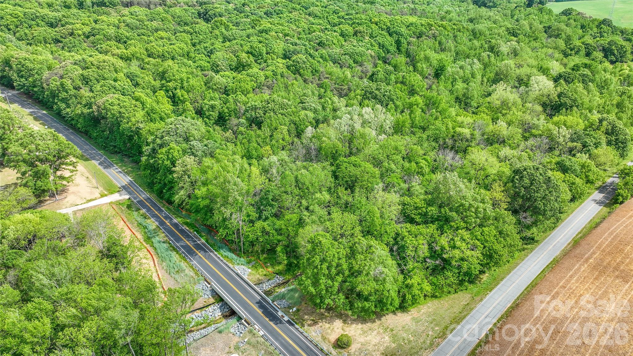 0 McIntyre Road, Unit 1 2 3 4 5 Wingate, NC 28174 - Photo 13 of 25 a view of a garden from a balcony