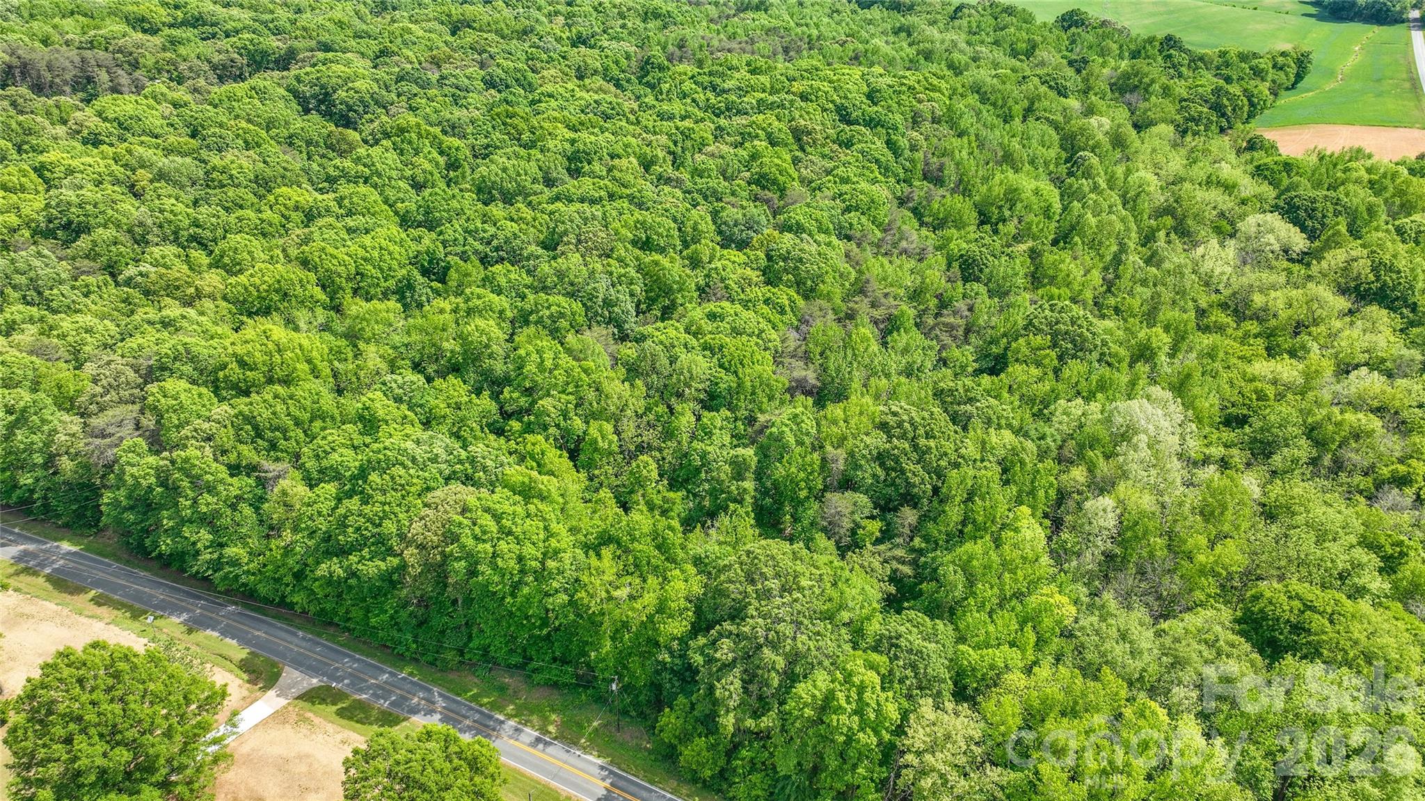 0 McIntyre Road, Unit 1 2 3 4 5 Wingate, NC 28174 - Photo 16 of 25 a view of a garden from a balcony