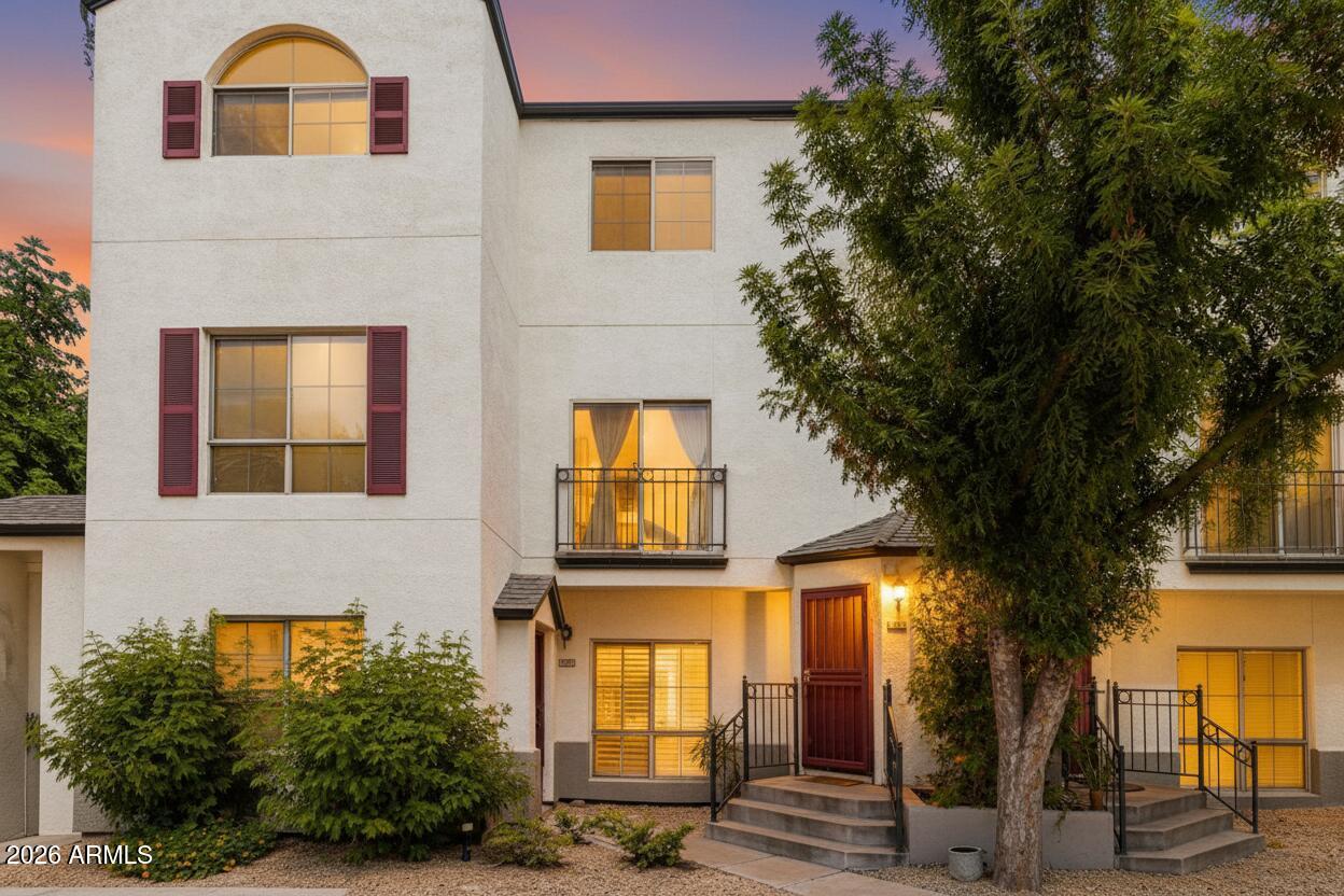 100 East Fillmore Street, Unit 216 Phoenix, AZ 85004 - Photo 1 of 36 a view of a brick house with large windows