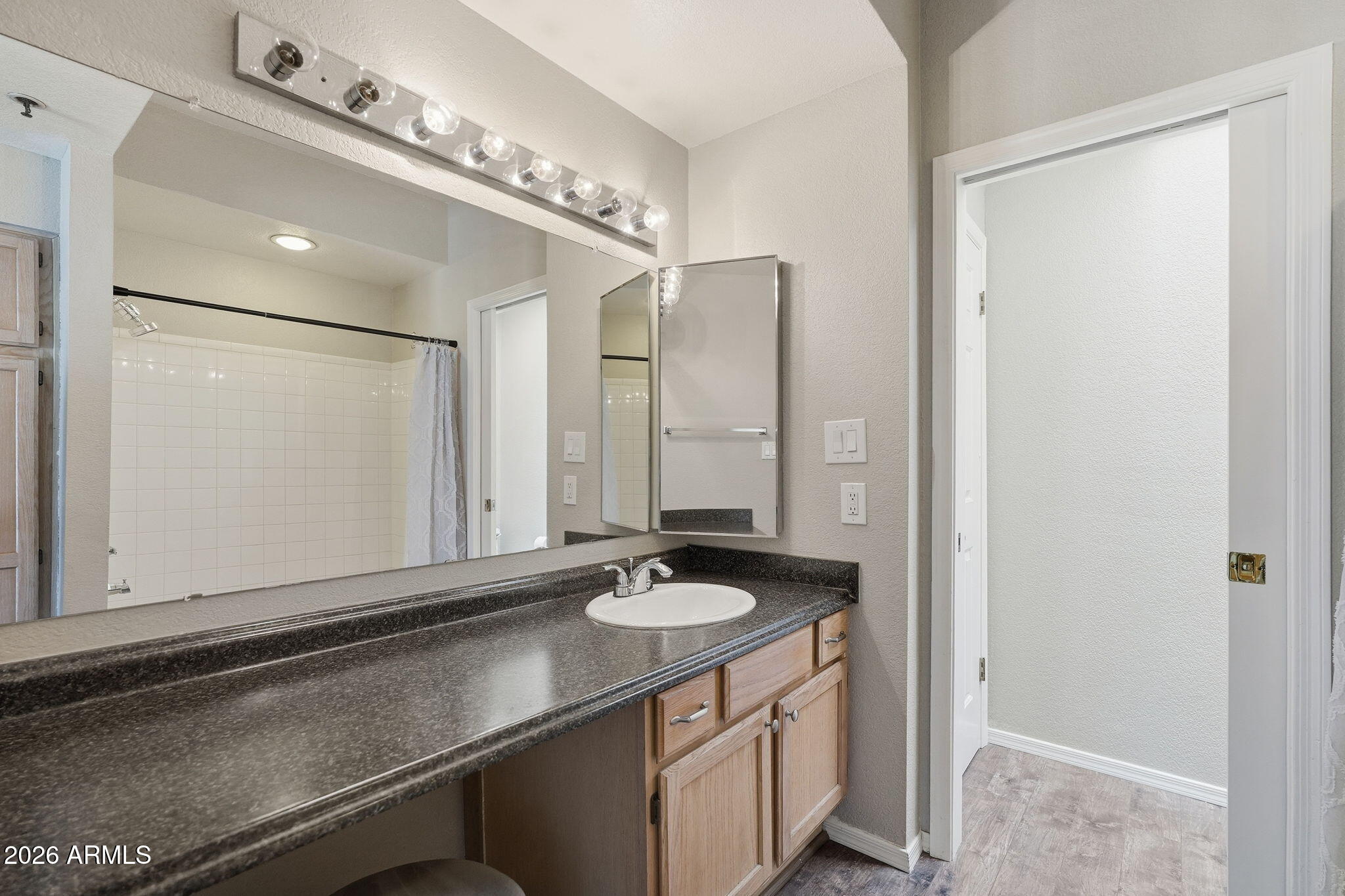 100 East Fillmore Street, Unit 216 Phoenix, AZ 85004 - Photo 11 of 36 a bathroom with a sink double vanity and a mirror