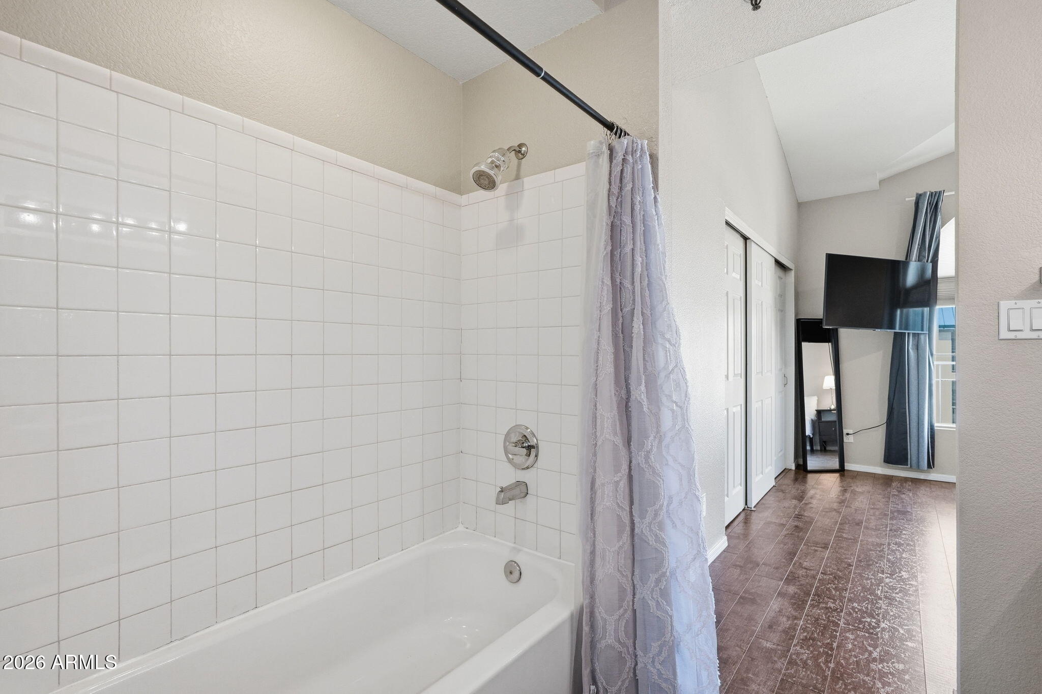 100 East Fillmore Street, Unit 216 Phoenix, AZ 85004 - Photo 12 of 36 a bathroom with a bathtub and a shower