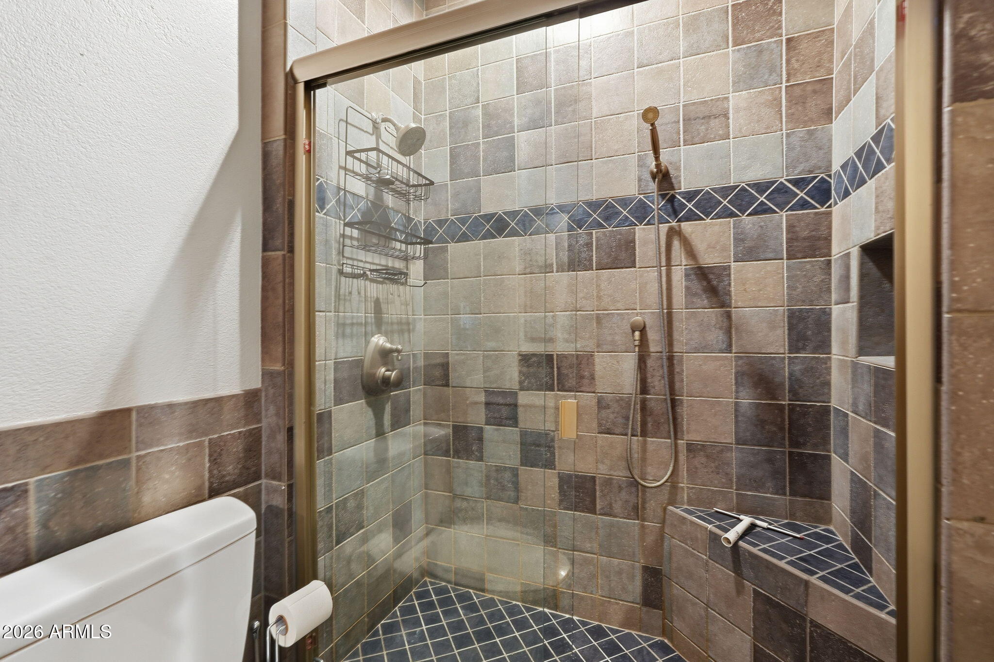 100 East Fillmore Street, Unit 216 Phoenix, AZ 85004 - Photo 14 of 36 a bathroom with a shower and toilet