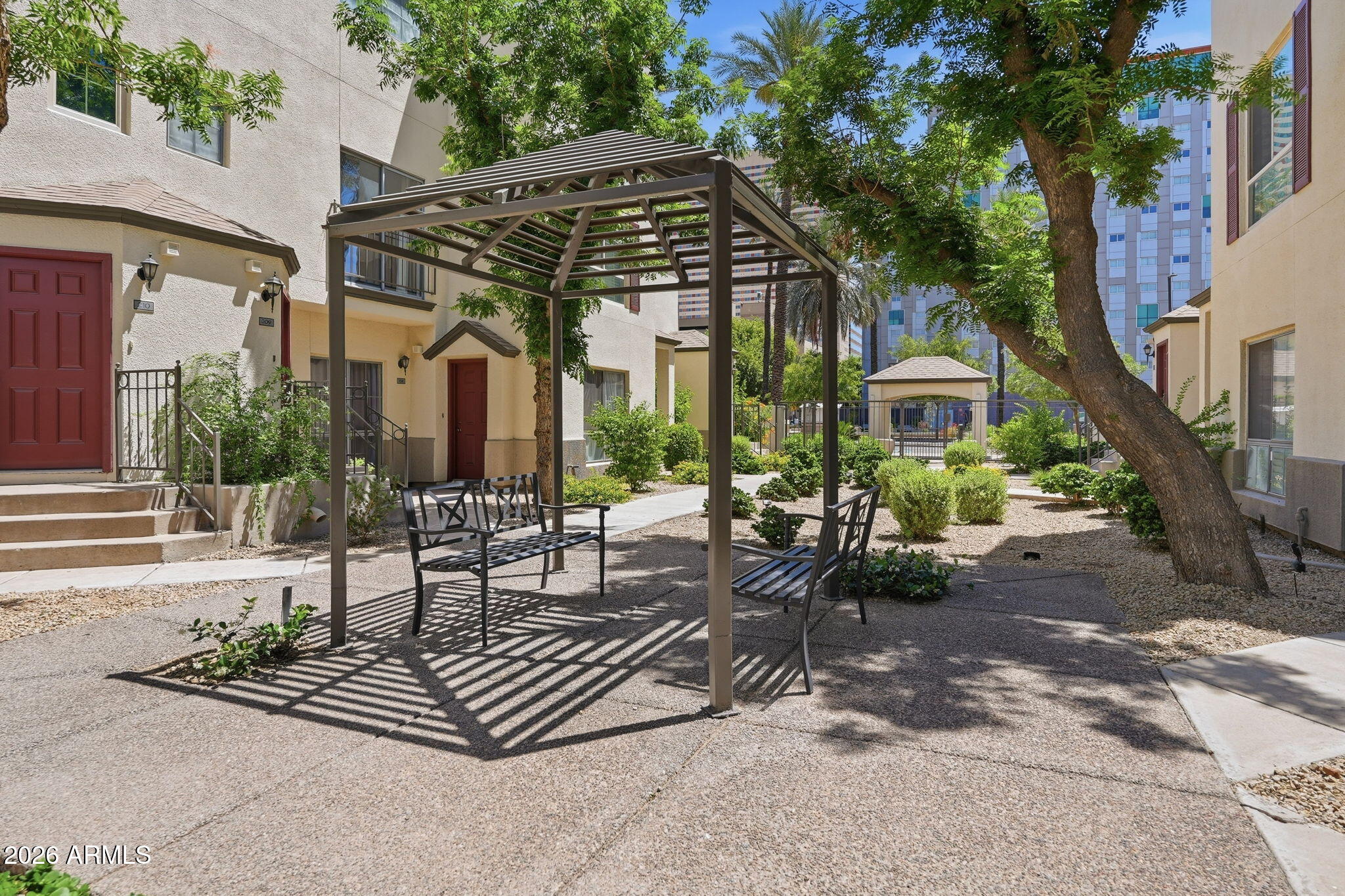 100 East Fillmore Street, Unit 216 Phoenix, AZ 85004 - Photo 18 of 36 a view of a chairs and table in the patio