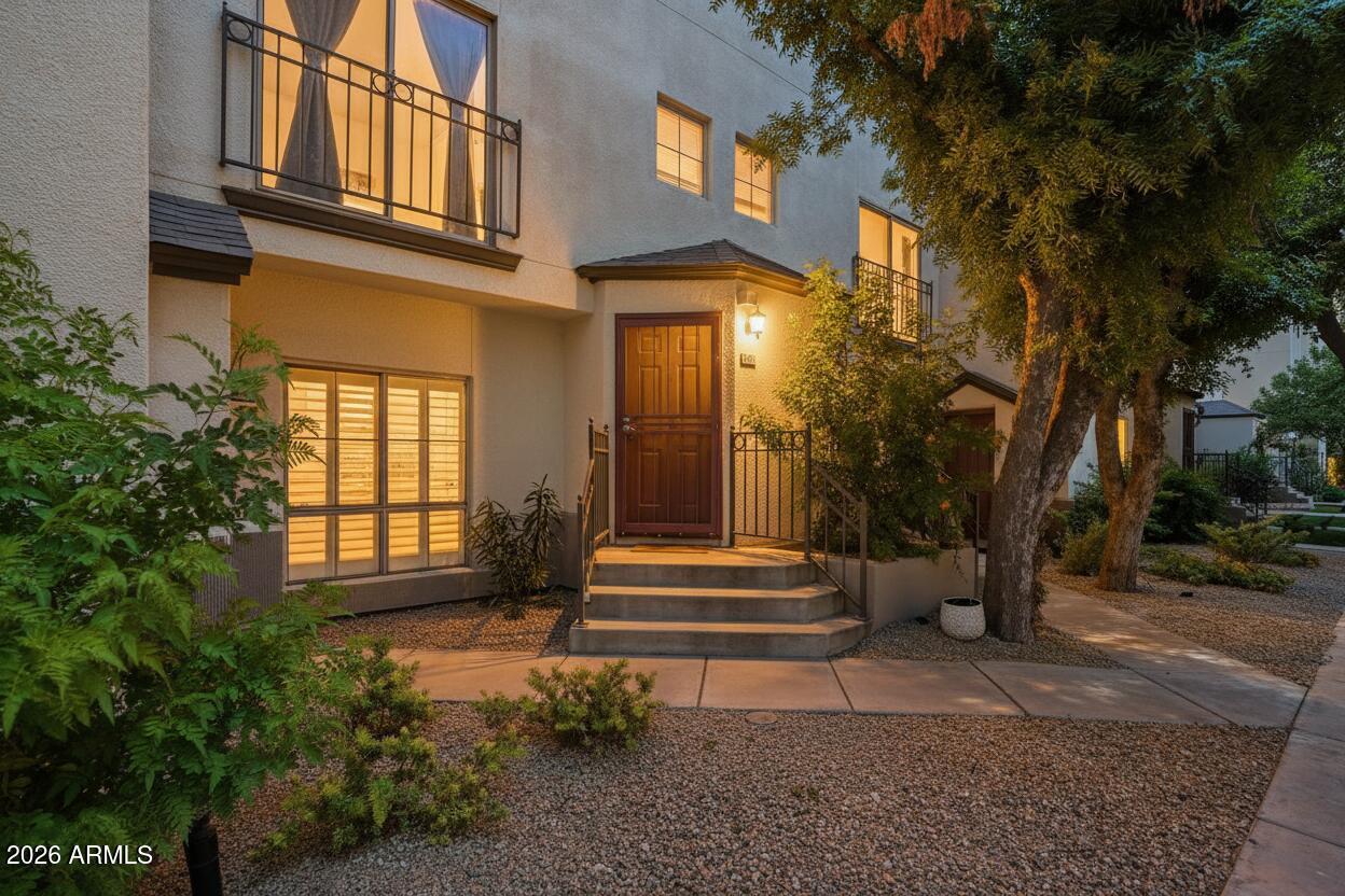 100 East Fillmore Street, Unit 216 Phoenix, AZ 85004 - Photo 2 of 36 a view of a building with a garden