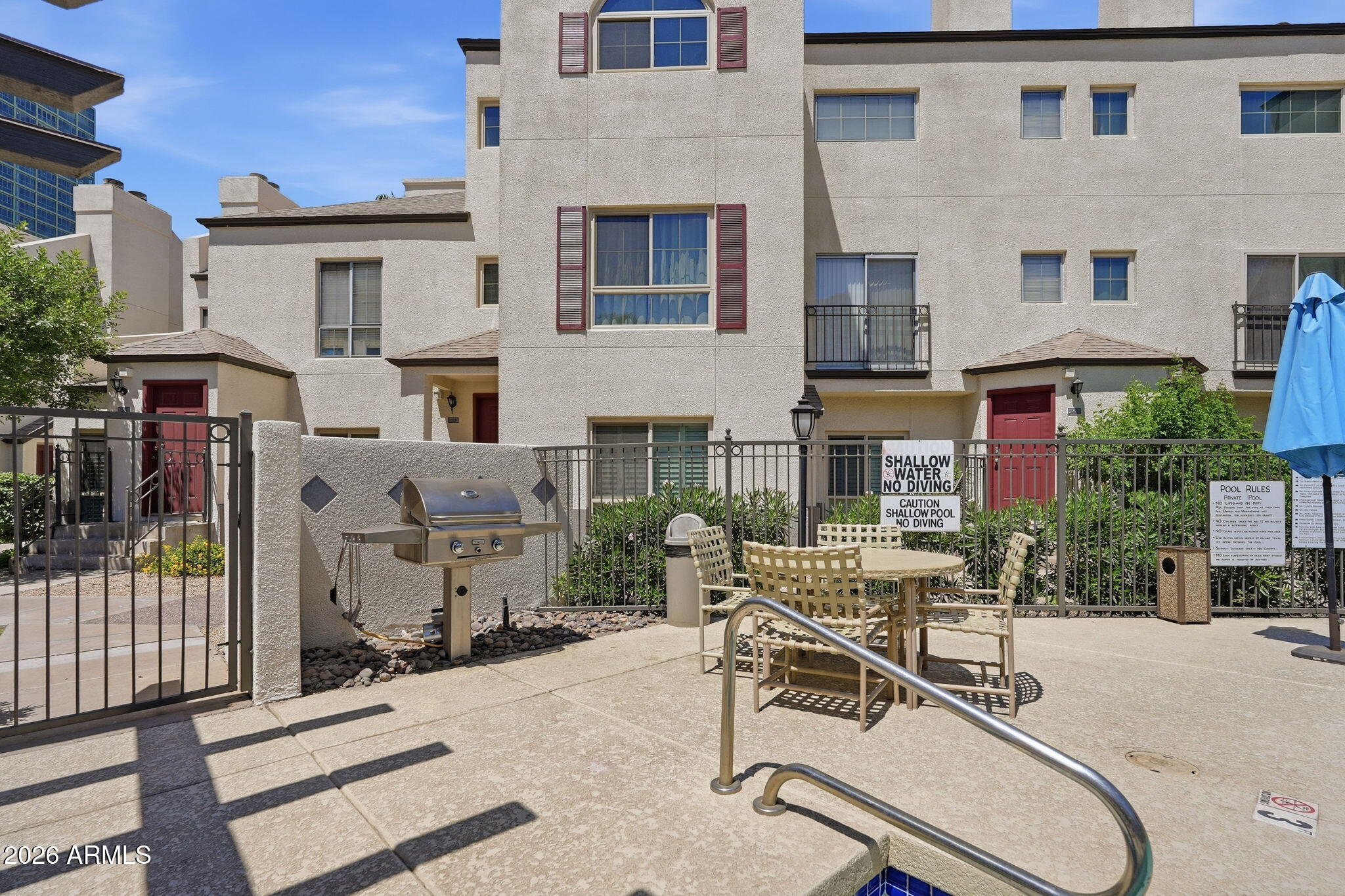 100 East Fillmore Street, Unit 216 Phoenix, AZ 85004 - Photo 21 of 36 a view of a building with a patio