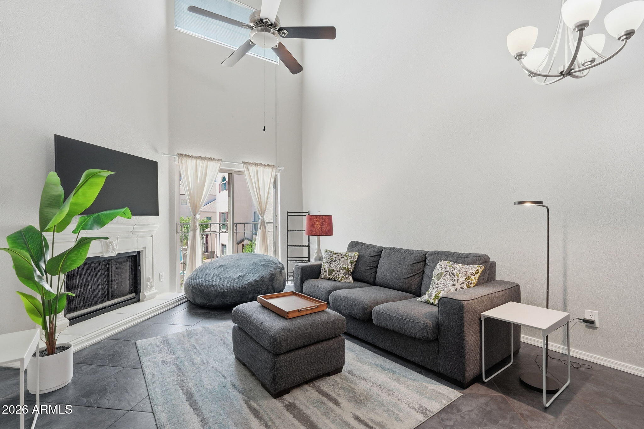 100 East Fillmore Street, Unit 216 Phoenix, AZ 85004 - Photo 6 of 36 a living room with furniture and a potted plant