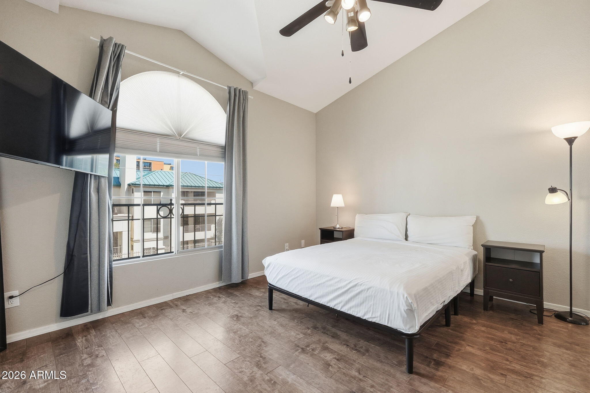 100 East Fillmore Street, Unit 216 Phoenix, AZ 85004 - Photo 10 of 36 a bedroom with a large bed and a large window