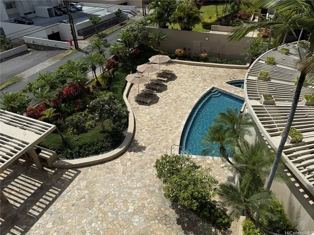 a view of a backyard with potted plants
