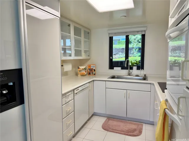 a kitchen with a sink and a window