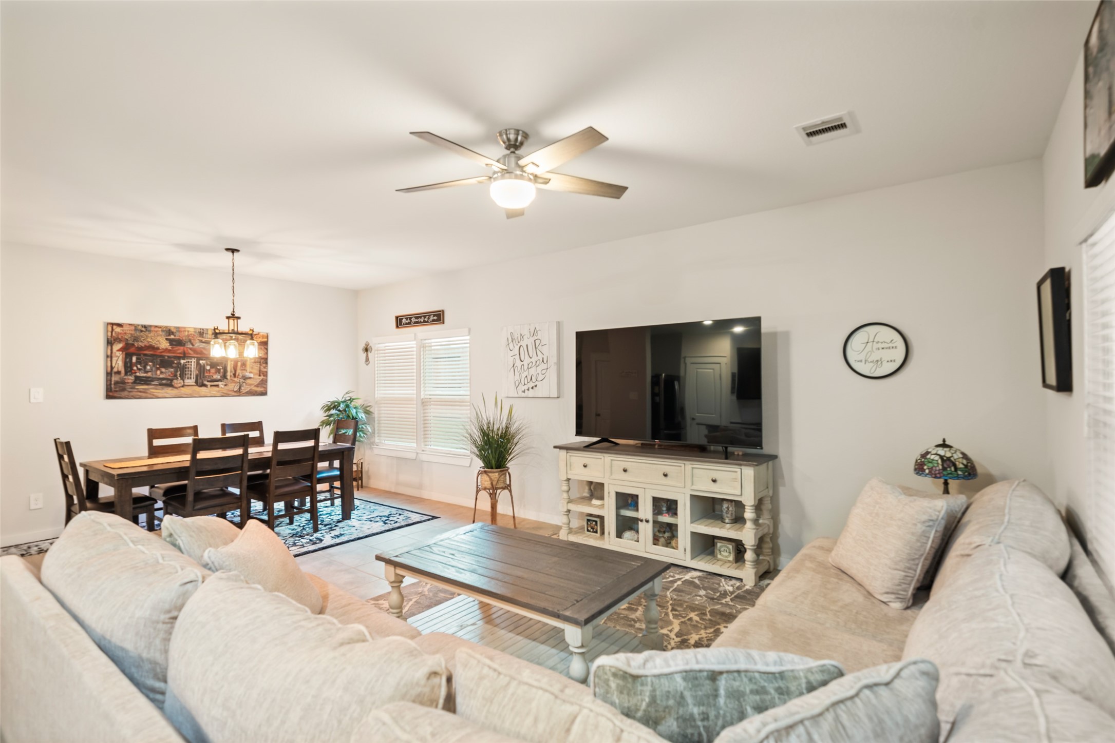 12158 Mustang Avenue Willis, TX 77378 - Photo 12 of 36 a living room with furniture and a flat screen tv