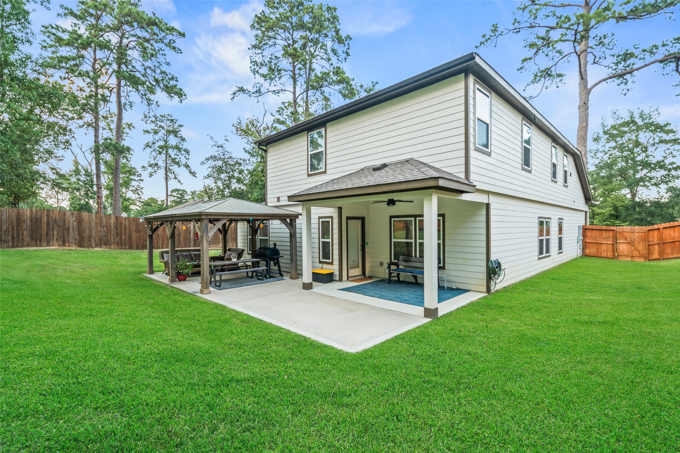 12158 Mustang Avenue Willis, TX 77378 - Photo 2 of 36 a view of a house with a yard and sitting area