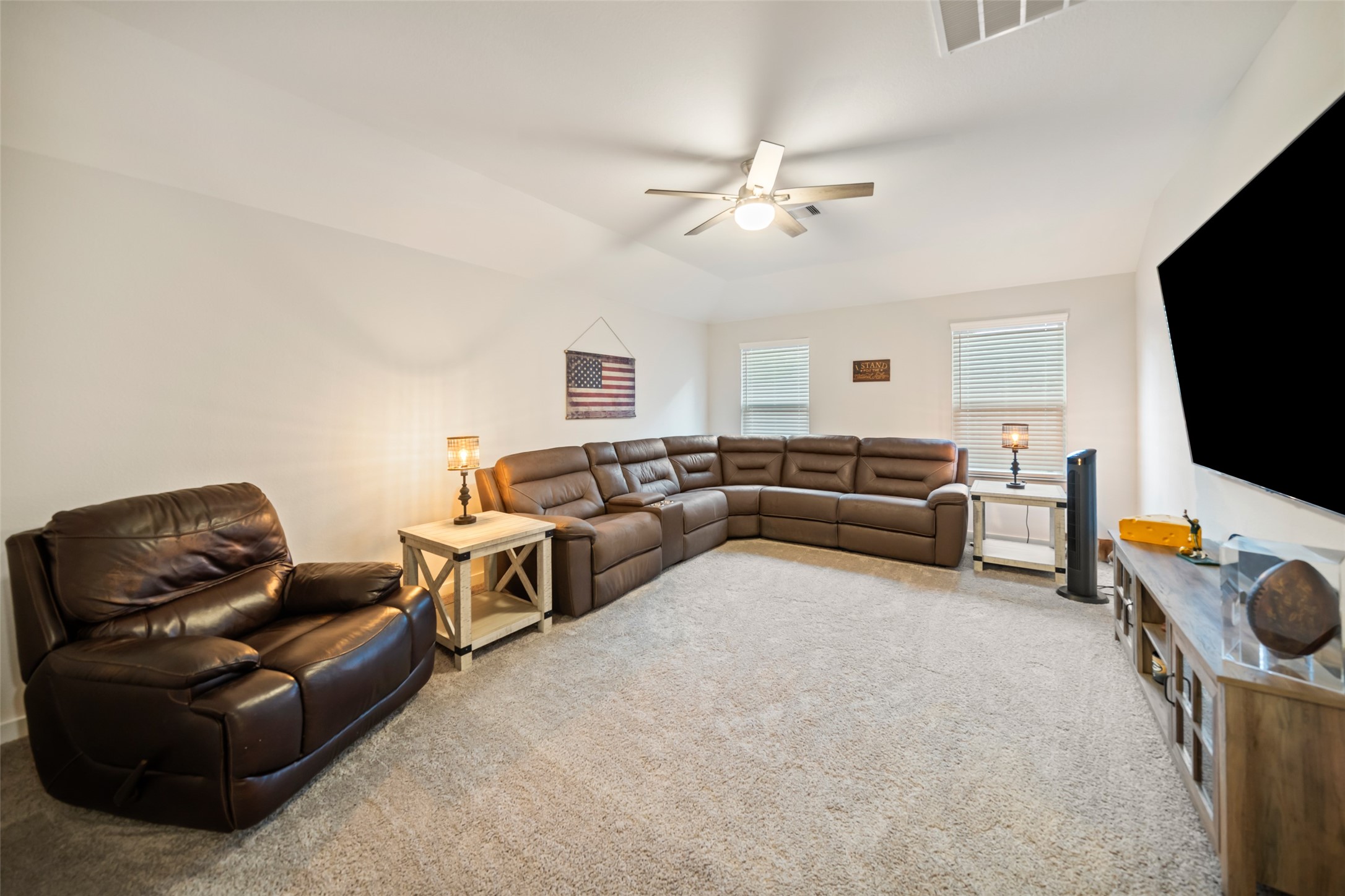 12158 Mustang Avenue Willis, TX 77378 - Photo 24 of 36 a living room with furniture and a flat screen tv
