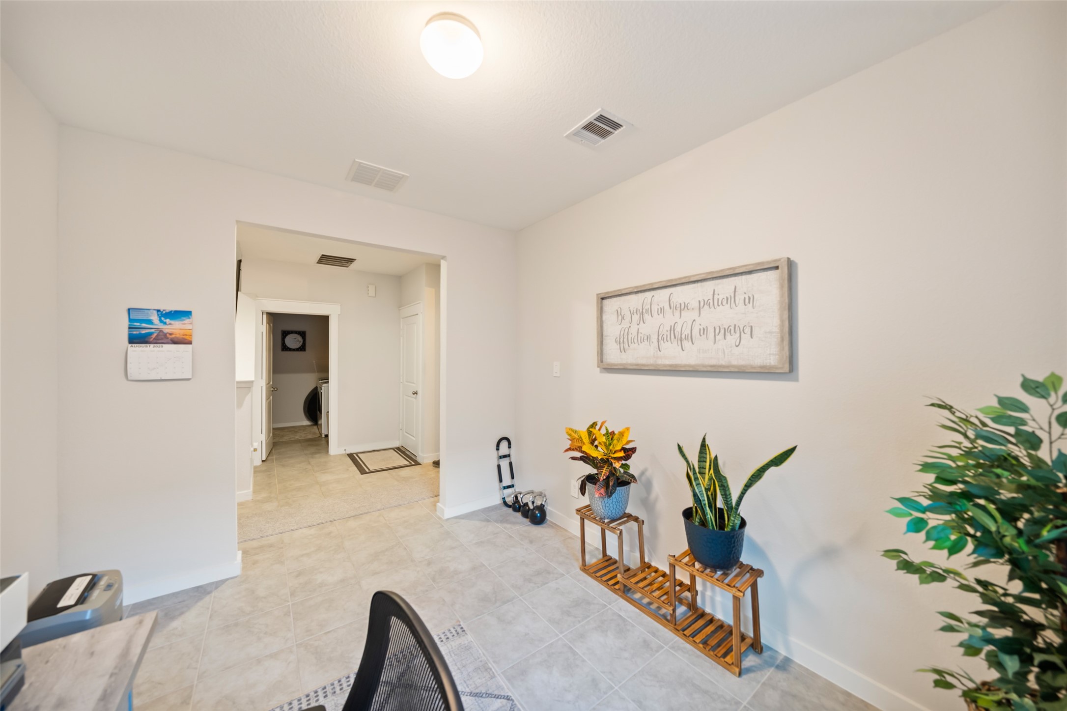 12158 Mustang Avenue Willis, TX 77378 - Photo 26 of 36 wooden floor with table and potted plants